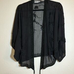 100%silk made in India black ornamentation shawl type cover. Size XL.